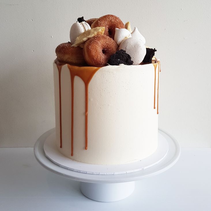 Drip Cake With Meringue, Macarons And Donuts
